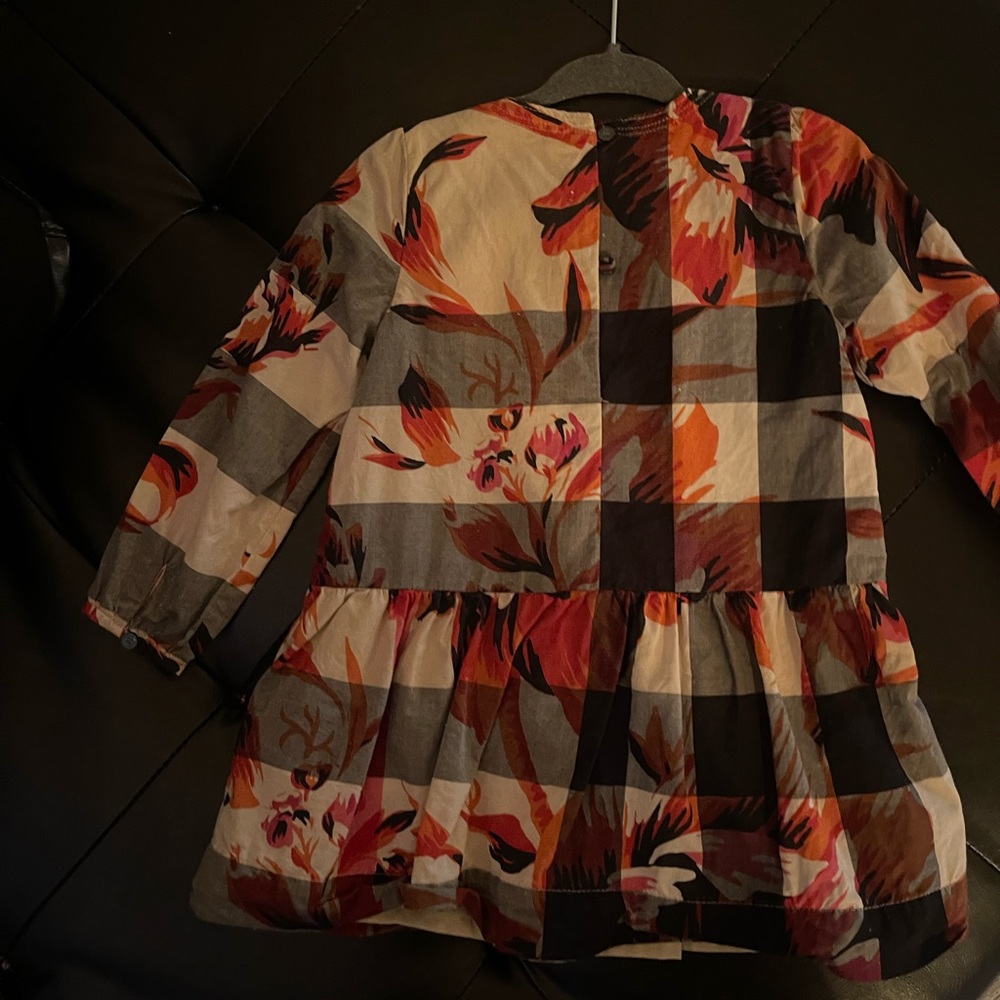 Burberry baby girl flower print over classic Burberry design.